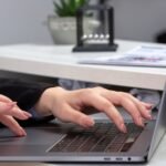 front view girl using laptop front table with schedules graphics using laptop job business activity scaled 1
